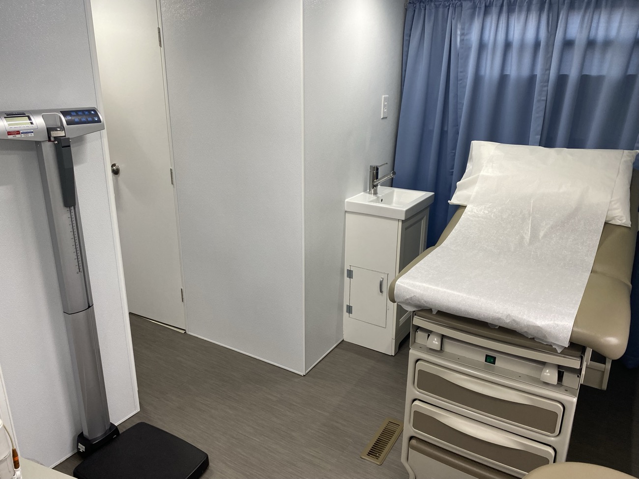 Healthcare exam-room casework and built-ins fabricated by Argent's Cabinet Shop